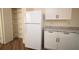 Well-lit kitchen featuring white cabinets, stainless steel appliances, and a walk-in pantry at 37045 North Ave, Dade City, FL 33523