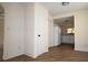 Entry room featuring wood-look vinyl flooring and an adjacent kitchen area at 37045 North Ave, Dade City, FL 33523