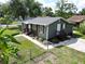 This single-story home features a well-maintained lawn and neutral paint scheme at 37045 North Ave, Dade City, FL 33523