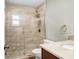 Bathroom with stand-up shower with glass door, vanity with sink and a towel ring at 3917 Casaba Loop, Valrico, FL 33596