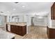 Spacious kitchen featuring granite countertops and a view into the living area for open-concept living at 3917 Casaba Loop, Valrico, FL 33596