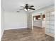 Bright living room features stylish wood floors and a doorway leading into the kitchen at 3917 Casaba Loop, Valrico, FL 33596