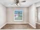 Bright living room features stylish wood floors, and a window letting in natural light at 3917 Casaba Loop, Valrico, FL 33596