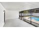 Enclosed patio area with pool view, providing ample space for outdoor entertainment at 3917 Casaba Loop, Valrico, FL 33596