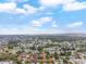 Expansive aerial view showcasing the lush community, surrounding neighborhood, and a nearby lake at 4036 Davit Dr, New Port Richey, FL 34652