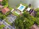 Stunning aerial view showcases community pool, tennis courts, and lush surroundings at 4036 Davit Dr, New Port Richey, FL 34652