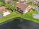 Aerial view of the townhouse overlooking a lake and green space at 4036 Davit Dr, New Port Richey, FL 34652