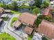 Aerial view of condos featuring mature landscaping, ponds and parking at 4036 Davit Dr, New Port Richey, FL 34652
