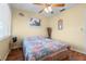 Comfortable bedroom with ceiling fan, a large window, and a serene atmosphere at 4036 Davit Dr, New Port Richey, FL 34652