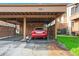 A well-maintained carport showcasing the assigned parking space for the townhome at 4036 Davit Dr, New Port Richey, FL 34652