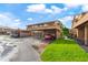 Townhome featuring designated covered parking with adjacent green space at 4036 Davit Dr, New Port Richey, FL 34652