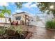 Community entrance with benches and landscaping at 4036 Davit Dr, New Port Richey, FL 34652