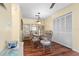 Dining room with wood floors, dining table, and decor at 4036 Davit Dr, New Port Richey, FL 34652