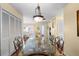 Bright dining room with unique glass table and chairs at 4036 Davit Dr, New Port Richey, FL 34652