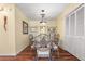 Bright dining room with wooden floors, and seating for four at 4036 Davit Dr, New Port Richey, FL 34652