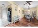 Bright dining room with wooden floors and seating for four, with nearby fridge at 4036 Davit Dr, New Port Richey, FL 34652