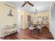 Bright dining room with wooden floors, and seating for four at 4036 Davit Dr, New Port Richey, FL 34652