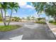 Exterior view of the community entrance with palm trees at 4036 Davit Dr, New Port Richey, FL 34652