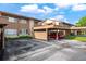 Townhome featuring assigned covered parking space and an adjacent lawn at 4036 Davit Dr, New Port Richey, FL 34652