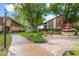 Exterior view of condos featuring mature landscaping and sidewalks at 4036 Davit Dr, New Port Richey, FL 34652