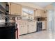 Functional kitchen featuring modern appliances, ample counter space, and a tile backsplash at 4036 Davit Dr, New Port Richey, FL 34652