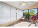 Enclosed lanai featuring tile floor, ceiling fan, and comfortable seating at 4036 Davit Dr, New Port Richey, FL 34652