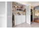 Laundry area with louvered closet doors and shelving at 4036 Davit Dr, New Port Richey, FL 34652