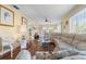 Bright living room with hardwood floors, comfortable seating, and sunny windows at 4036 Davit Dr, New Port Richey, FL 34652