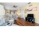 Well-lit living room boasts hardwood floors, ceiling fan, and plenty of space at 4036 Davit Dr, New Port Richey, FL 34652
