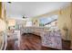 Cozy living room with hardwood floors, ceiling fan, and ample seating for relaxation at 4036 Davit Dr, New Port Richey, FL 34652