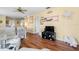 Comfortable living room with light yellow walls, wood floors and relaxed décor at 4036 Davit Dr, New Port Richey, FL 34652