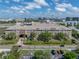 Extensive aerial view of apartment complex with manicured lawns and nearby urban landscape at 4221 W Spruce St # 2302, Tampa, FL 33607