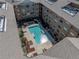 Aerial view of a complex showing the central pool area with lounge seating at 4221 W Spruce St # 2302, Tampa, FL 33607