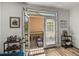 Living room with french doors that open to a balcony overlooking the parking area and surrounding buildings at 4221 W Spruce St # 2302, Tampa, FL 33607