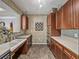 Efficient kitchen space with tiled flooring, ample cabinet space, and modern appliances at 4221 W Spruce St # 2302, Tampa, FL 33607
