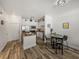 Kitchen with white cabinets, stainless steel appliances, and adjacent dining area at 4221 W Spruce St # 2302, Tampa, FL 33607