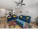 Spacious living area with sofas and view into the modern kitchen is ideal for entertaining and relaxation at 4221 W Spruce St # 2302, Tampa, FL 33607