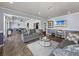 Community lounge features sofas, modern tables, and TV at 4221 W Spruce St # 2302, Tampa, FL 33607