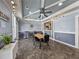 Community lounge with tile flooring, decorative lighting, table, and seating for gatherings at 4221 W Spruce St # 2302, Tampa, FL 33607