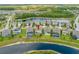 Aerial view of property backing up to a pond, featuring a screened pool at 4633 Ballantrae Blvd, Land O Lakes, FL 34638