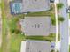 An aerial perspective reveals an expansive, meticulously landscaped backyard with a charming patio and verdant lawn at 4633 Ballantrae Blvd, Land O Lakes, FL 34638