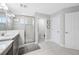 Bathroom featuring glass enclosed shower, dual vanity and decorative tile at 4633 Ballantrae Blvd, Land O Lakes, FL 34638