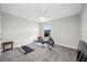 Bedroom features a ceiling fan, gray carpet, and workout equipment at 4633 Ballantrae Blvd, Land O Lakes, FL 34638