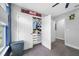 Bedroom closet with open doors and full-length shelves for optimal storage at 4633 Ballantrae Blvd, Land O Lakes, FL 34638