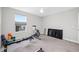 Bedroom features a ceiling fan, gray carpet, and workout equipment at 4633 Ballantrae Blvd, Land O Lakes, FL 34638