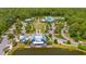Aerial view of the community clubhouse overlooking a scenic pond and green space at 4633 Ballantrae Blvd, Land O Lakes, FL 34638