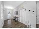 Inviting entryway with modern lighting, wood-look flooring, and stylish decor at 4633 Ballantrae Blvd, Land O Lakes, FL 34638