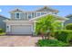 Attractive home exterior with a two-car garage, manicured landscaping, and a welcoming front entrance at 4633 Ballantrae Blvd, Land O Lakes, FL 34638