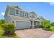 Charming two-story home features a manicured front yard, brick paved driveway, and a two-car garage at 4633 Ballantrae Blvd, Land O Lakes, FL 34638