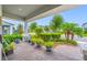 View of the front porch and landscaped yard featuring plants and palm trees at 4633 Ballantrae Blvd, Land O Lakes, FL 34638